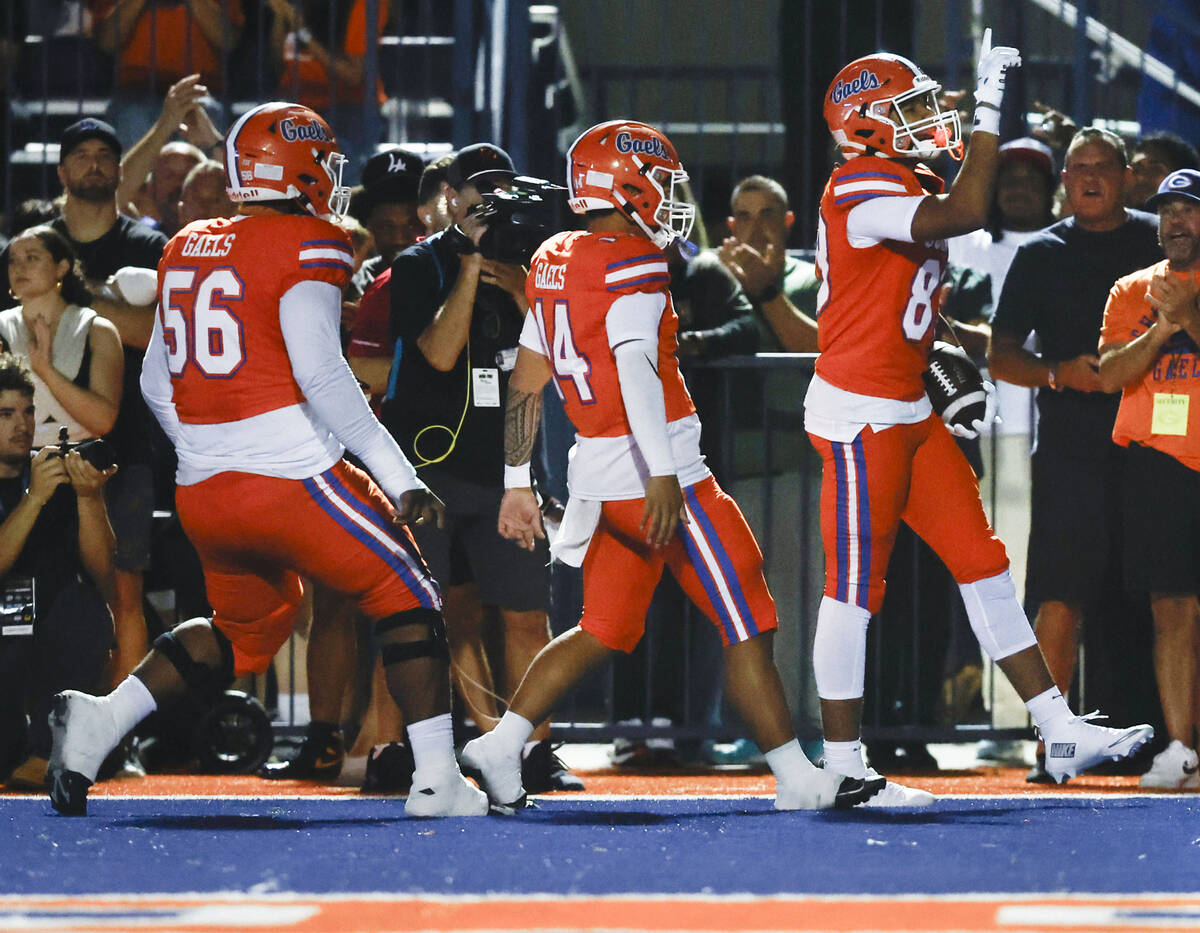 Bishop Gorman wide receiver Damari Hall (83) celebrates a first half touchdown catch with teamm ...