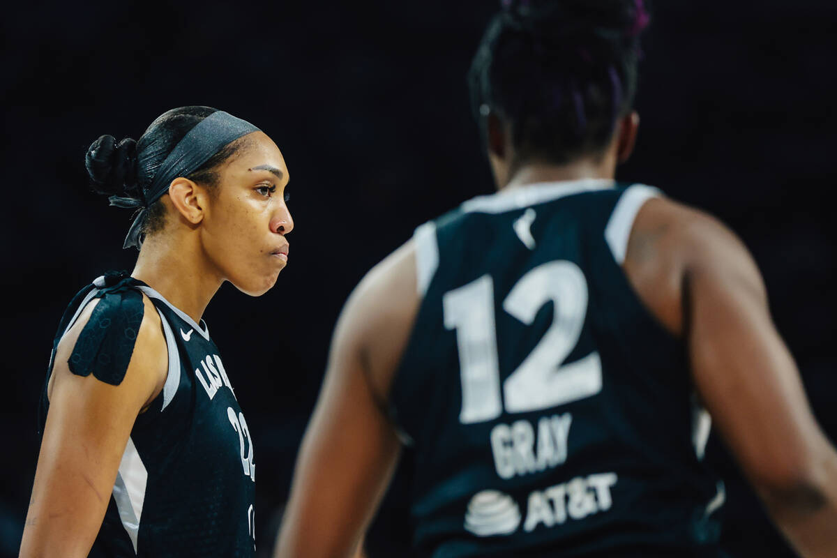 Aces center A'ja Wilson (22) listens to Aces guard Chelsea Gray (12) during game one of a ...
