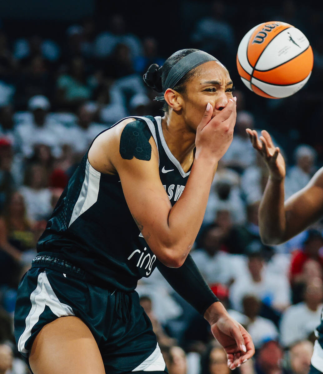 Aces center A'ja Wilson (22) reacts to a brief injury during game one of a round two WNBA ...
