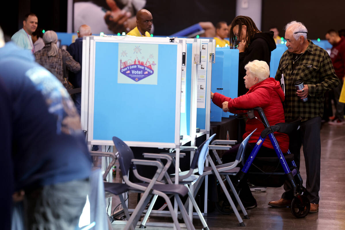 Cindy Dekeukeleire votes with her husband J.R. Dekeukeleire at Allegiant Stadium in Las Vegas o ...