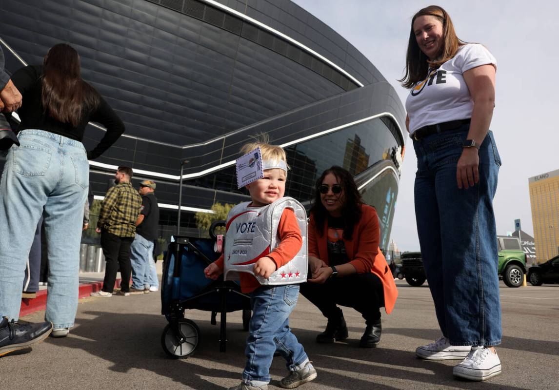 Murray, no last name given, arrives to vote with his parents at Allegiant Stadium in Las Vegas ...