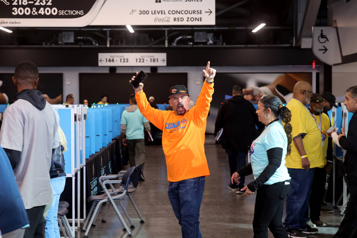 Laborers Local 872 member Jake Macias celebrates before voting at Allegiant Stadium in Las Vega ...