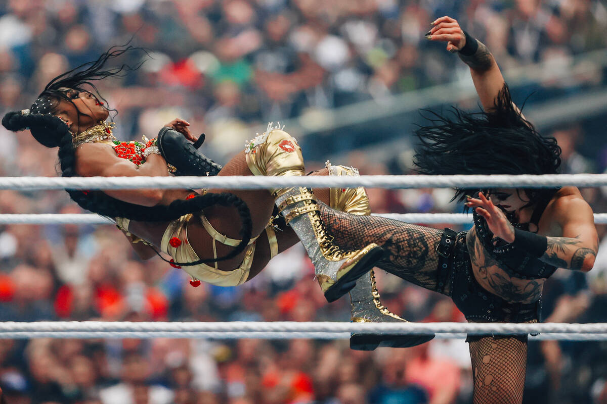 Bianca Belair, left, is kicked by Rhea Ripley during WWE WrestleMania 41 at Allegiant Stadium S ...