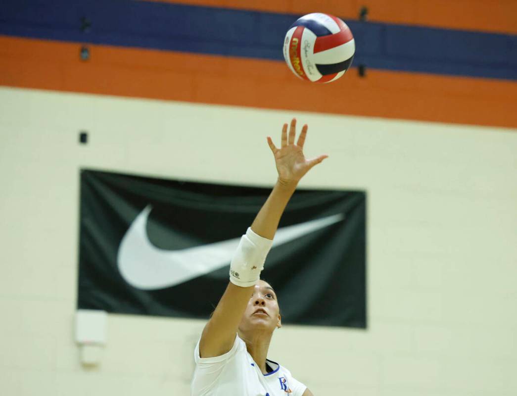 Bishop Gorman's Ayanna Watson serves during their home matchup with Shadow Ridge on Tuesda ...
