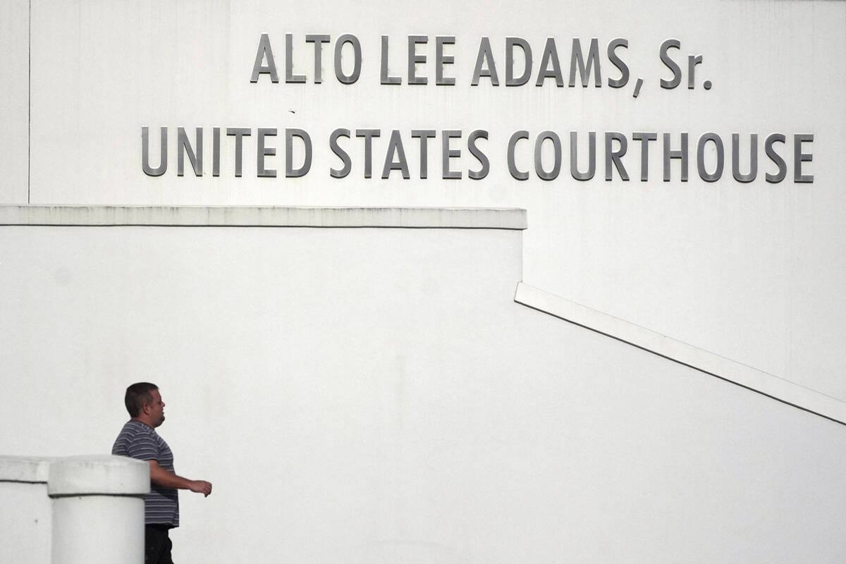A man leaves the Alto Lee Adams Sr. U.S. Courthouse as jury selection began in the trial of Rya ...