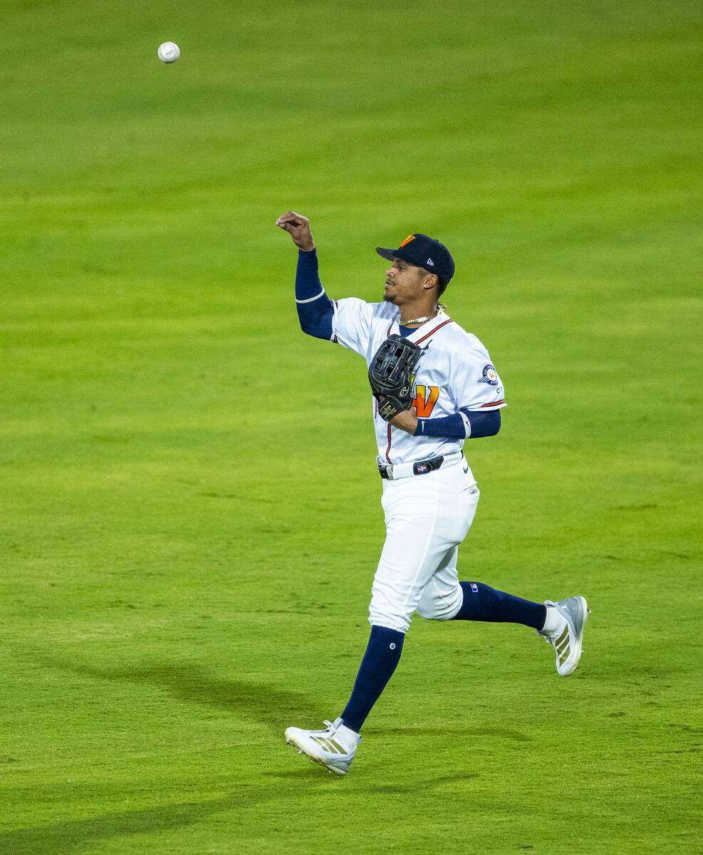 Aviators outfielder Junior Perez (1) tosses the ball after a catch against the Tacoma Rainiers ...