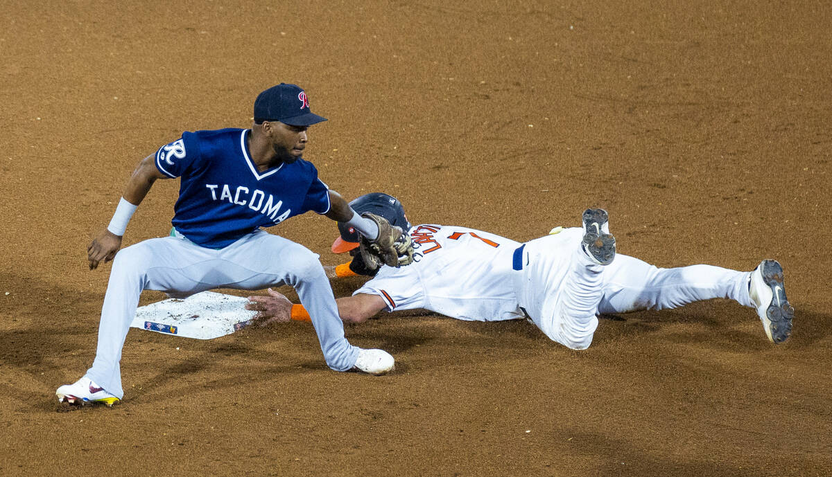 Aviators catcher Bryan Lavastida (7) slides into second base just ahead of a tag by Tacoma Rain ...