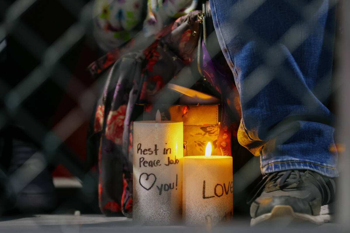 Faux candles sit at attendees’ feet during a vigil in Jovonn “JoJo” Magee-Thomas' honor o ...