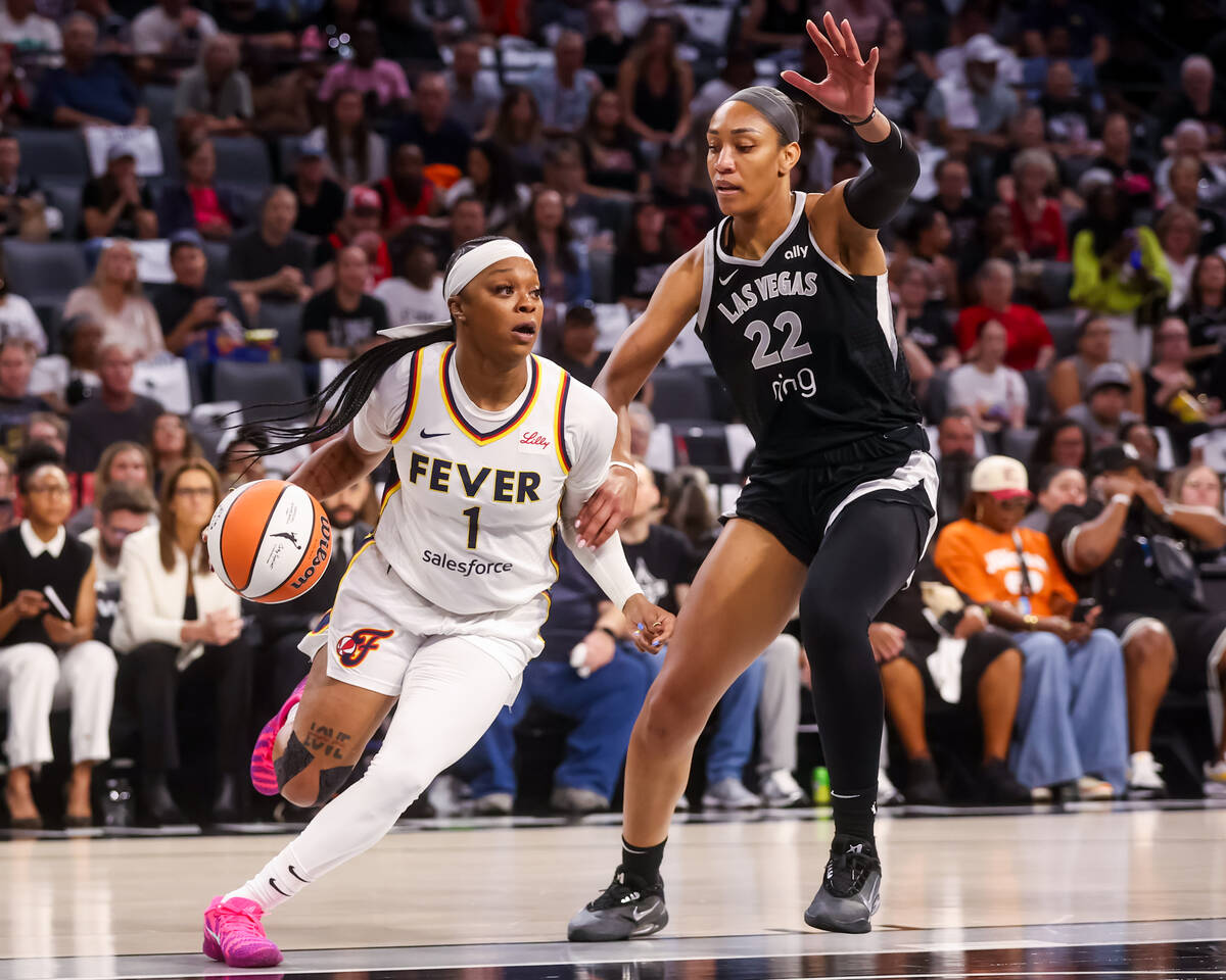 Indiana Fever guard Odyssey Sims (1) drives to the basket against Aces center A'ja Wilson ...