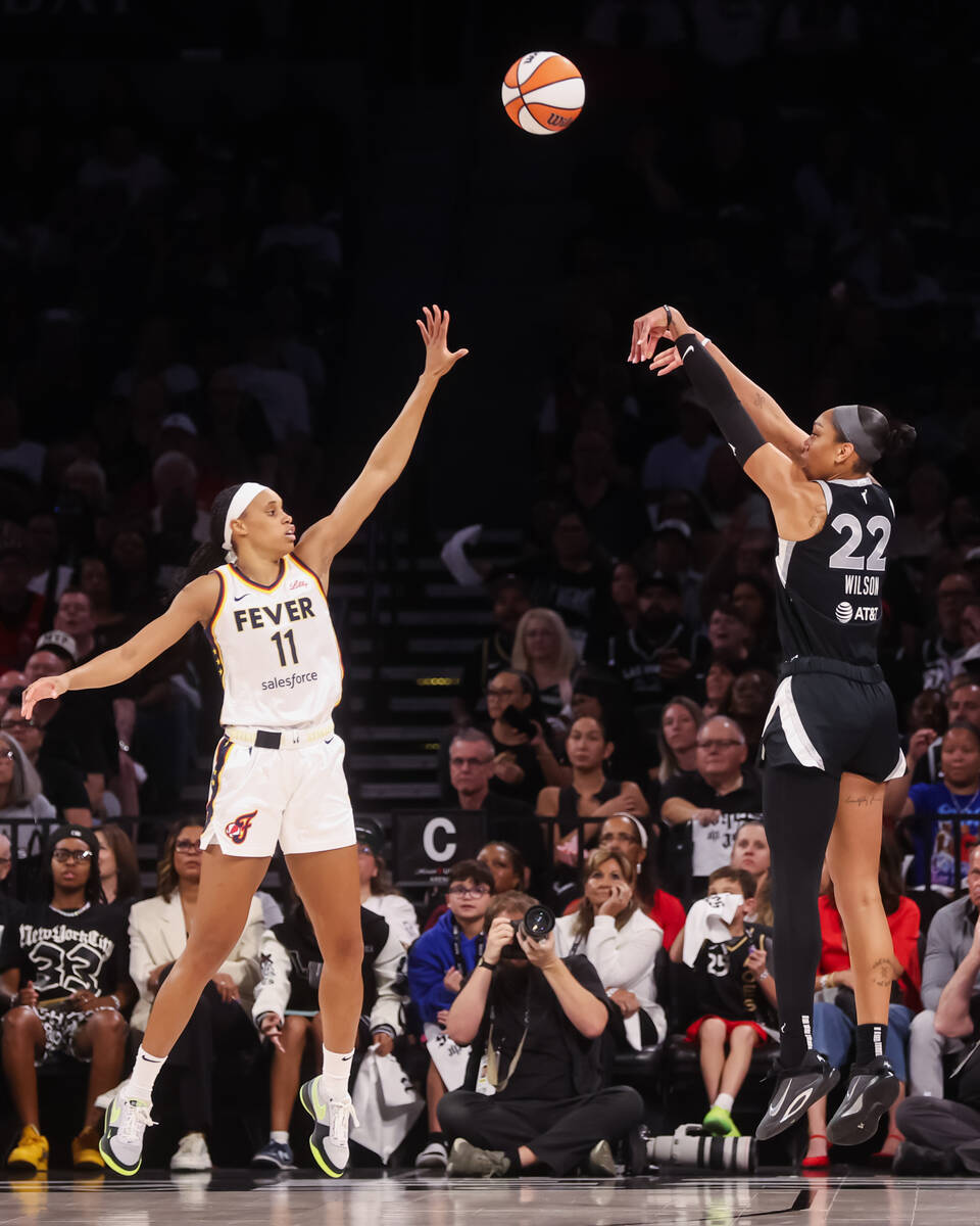 Aces center A'ja Wilson (22) shoots over Indiana Fever forward Brianna Turner (11) during ...