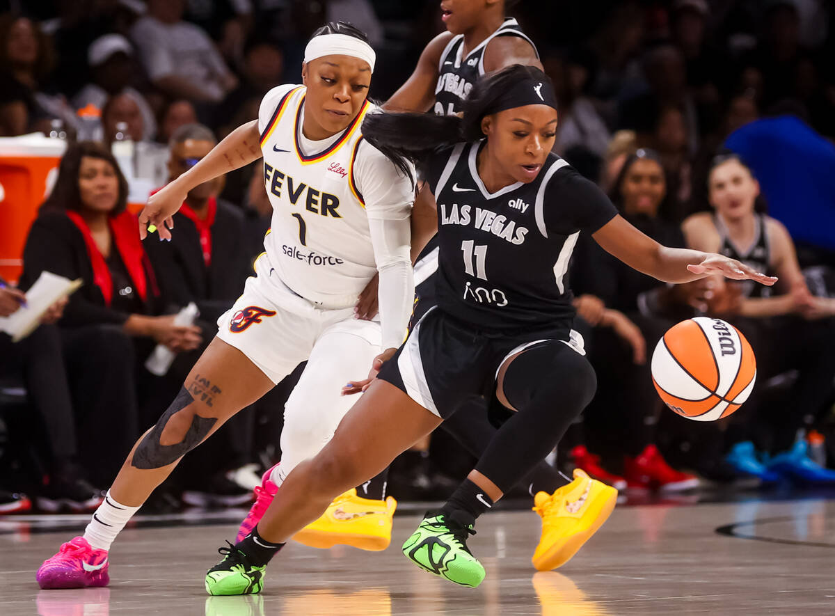 Aces guard Dana Evans (11) gets to the basketball ahead of Indiana Fever guard Odyssey Sims (1) ...
