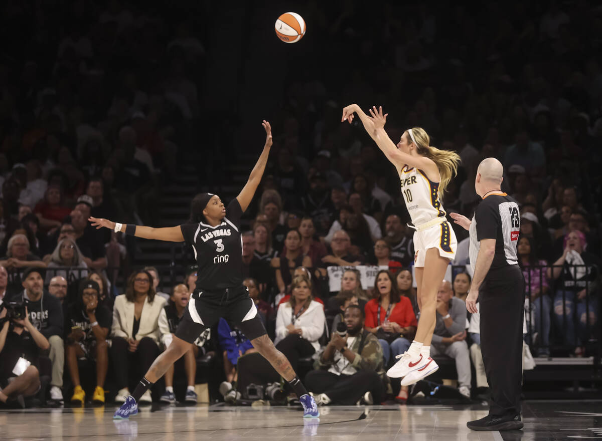 Indiana Fever guard Lexie Hull (10) shoots over Aces forward NaLyssa Smith (3) during the secon ...