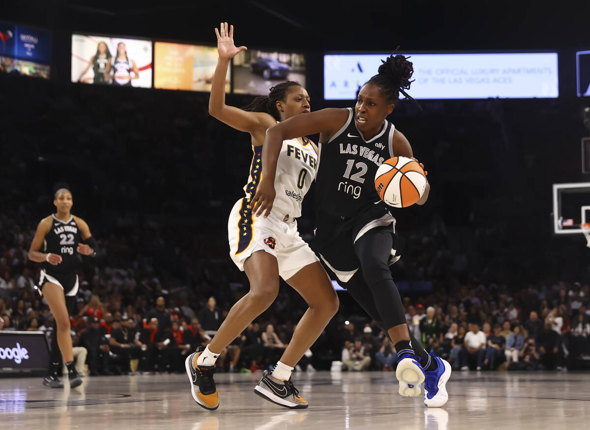 Aces guard Chelsea Gray (12) drives to the basket against Indiana Fever guard Kelsey Mitchell ( ...
