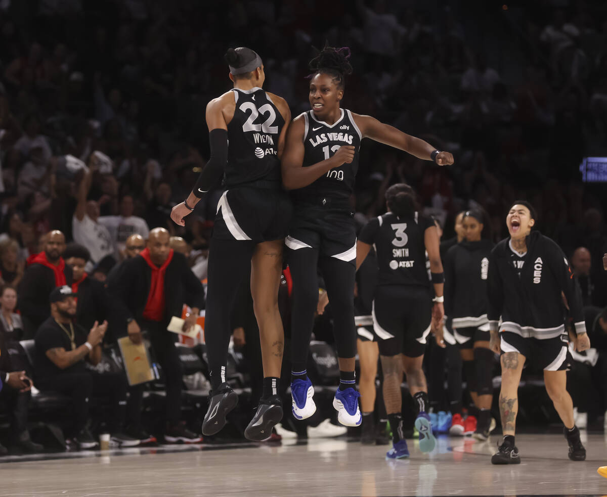 Aces guard Chelsea Gray (12) and Aces center A'ja Wilson (22) celebrate after a play again ...