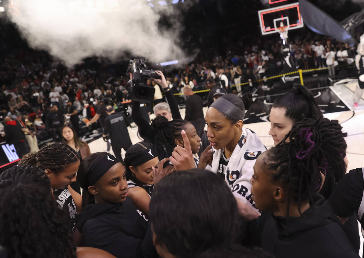 Aces center A'ja Wilson huddles with her team after defeating the Indiana Fever in Game 2 ...