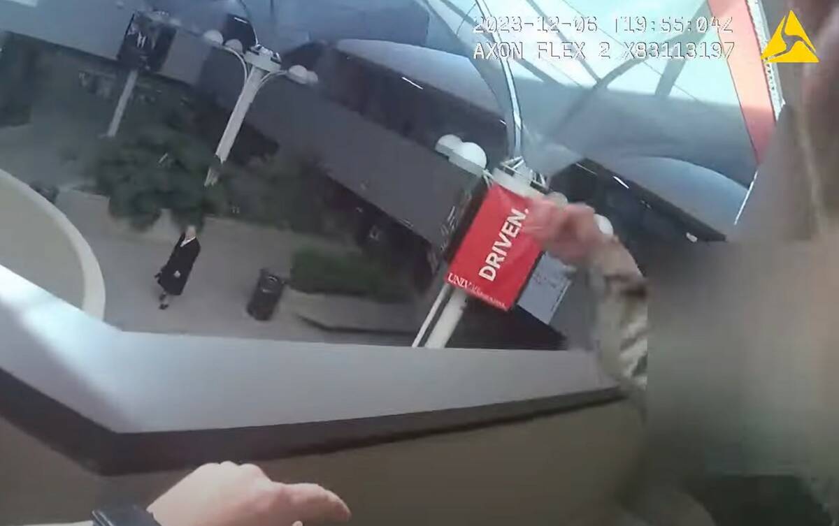 This screen capture from bodycam video shows two Las Vegas police officers responding to the sc ...