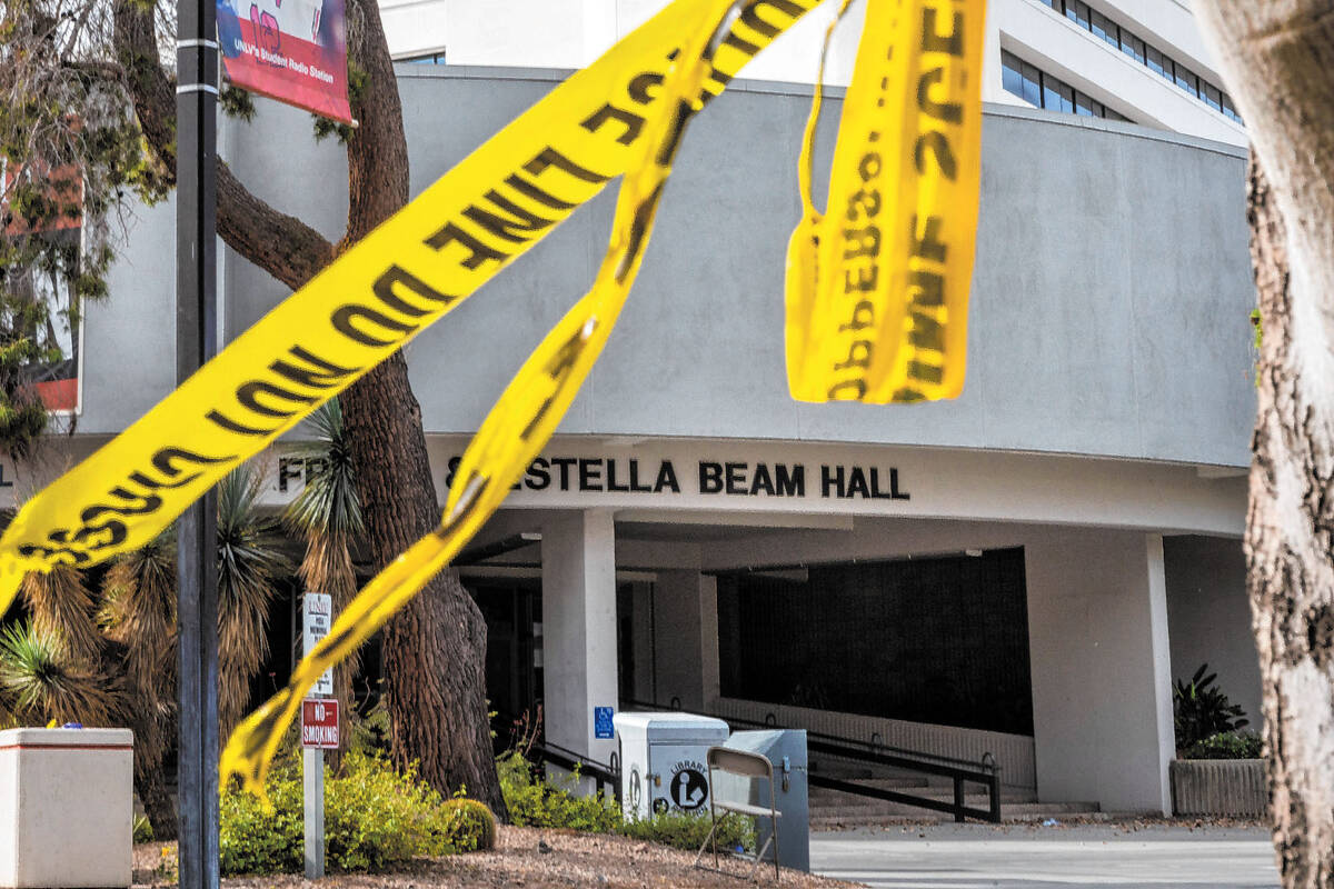 Police tape remains on a tree outside the entrance to the Frank and Estella Beam Hall following ...