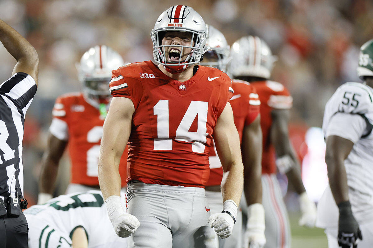 Ohio State defensive lineman Beau Atkinson celebrates his sack against Ohio during the second h ...