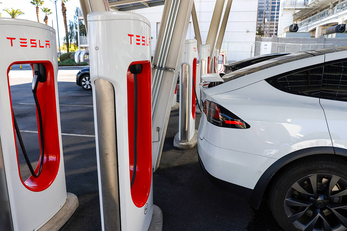 Tesla electric vehicles are charged at a charging station at the Linq, on Wednesday, March 19, ...