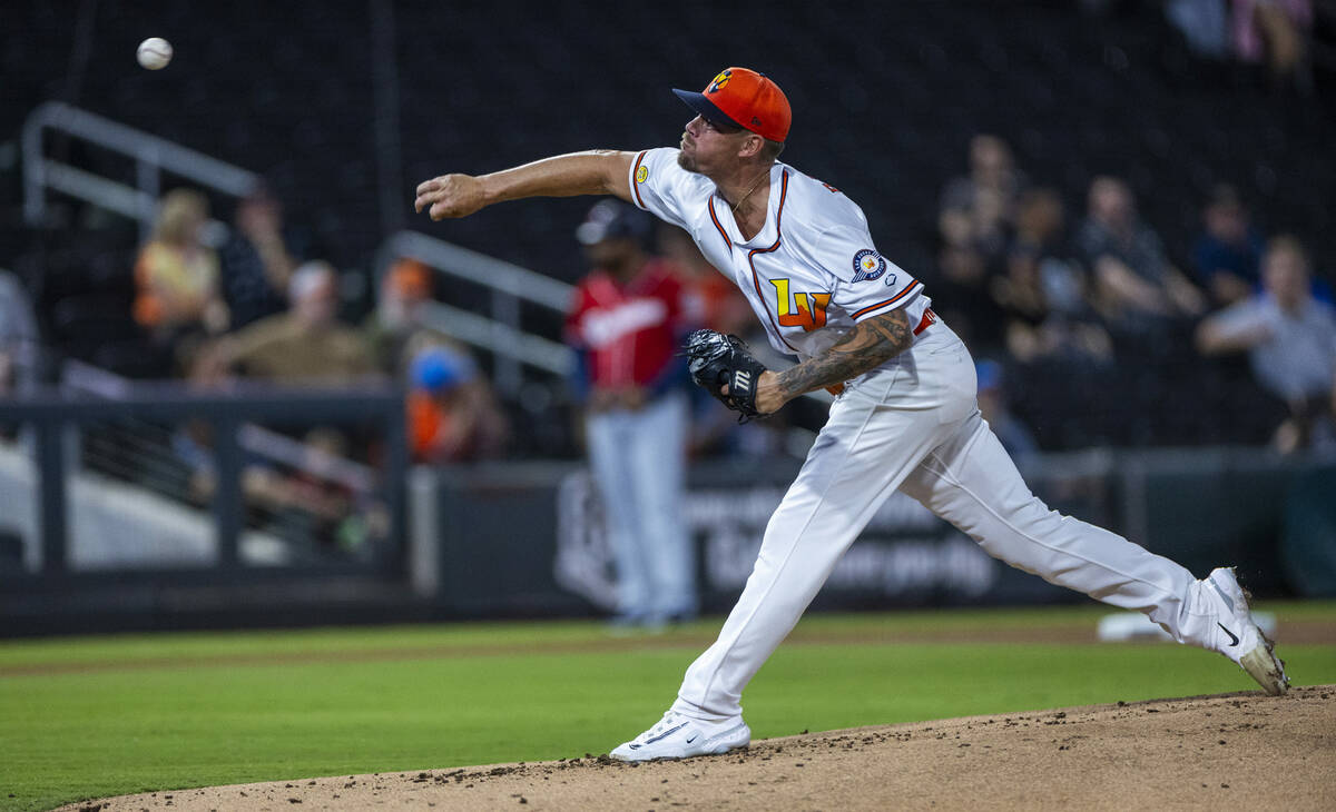 Aviators pitcher Aaron Brooks (49) tosses a ball to a Tacoma Rainiers batter during Game 2 of t ...