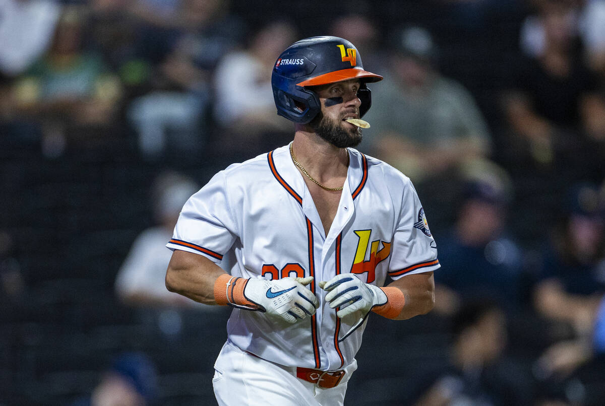 Aviators outfielder Nick Martini (38) takes first base with a mouth piece in against the Tacoma ...