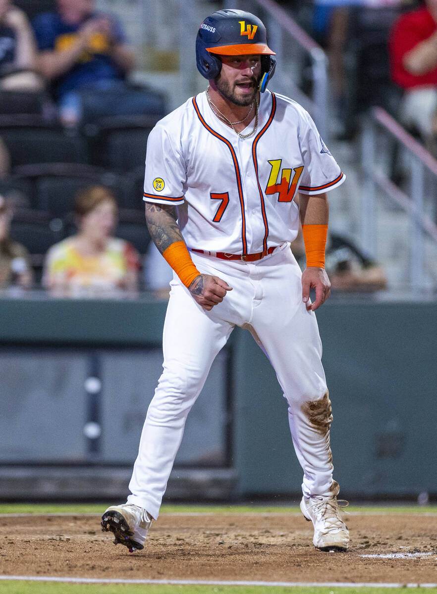 Aviators catcher Bryan Lavastida (7) arrives home safely against the Tacoma Rainiers during Gam ...