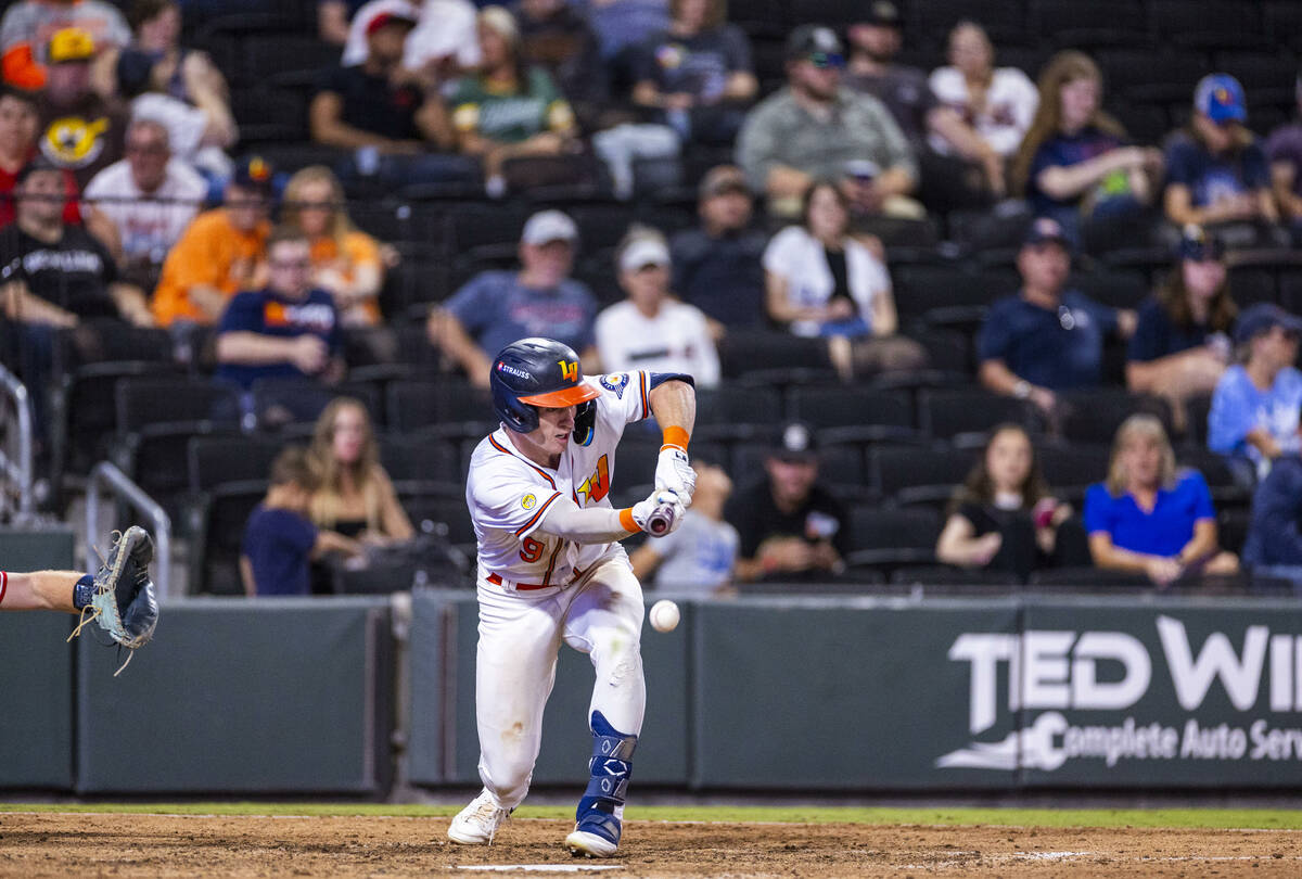 Aviators infielder Cooper Bowman (9) bunts the ball in their win over the Tacoma Rainiers 7-3 d ...