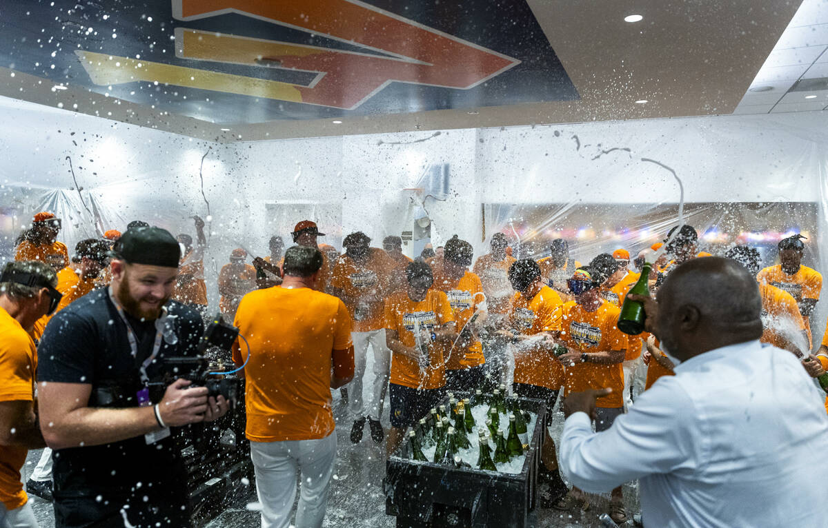 Legendary player Dave Stewart, right, joins the Aviators in a champagne shower as they celebrat ...