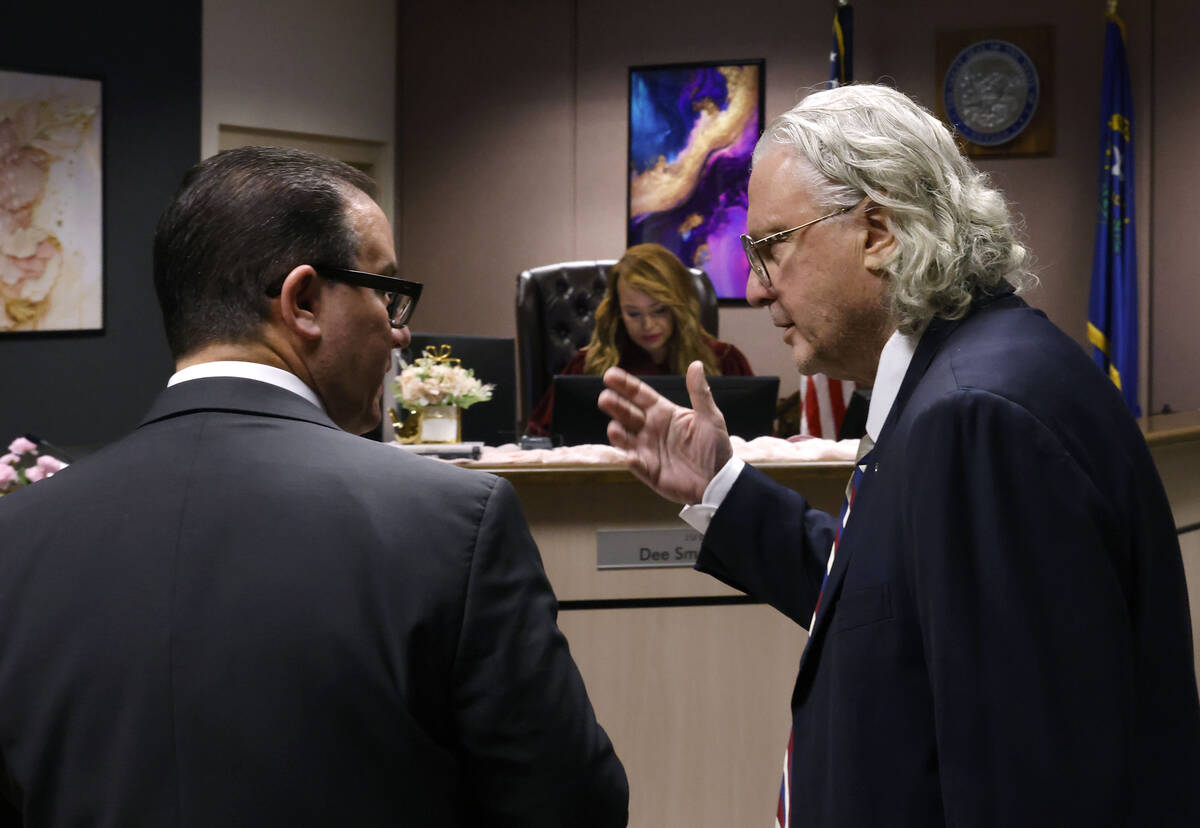 Attorneys Richard Schonfeld, left, and David Chesnoff confer during a hearing in Clark County F ...