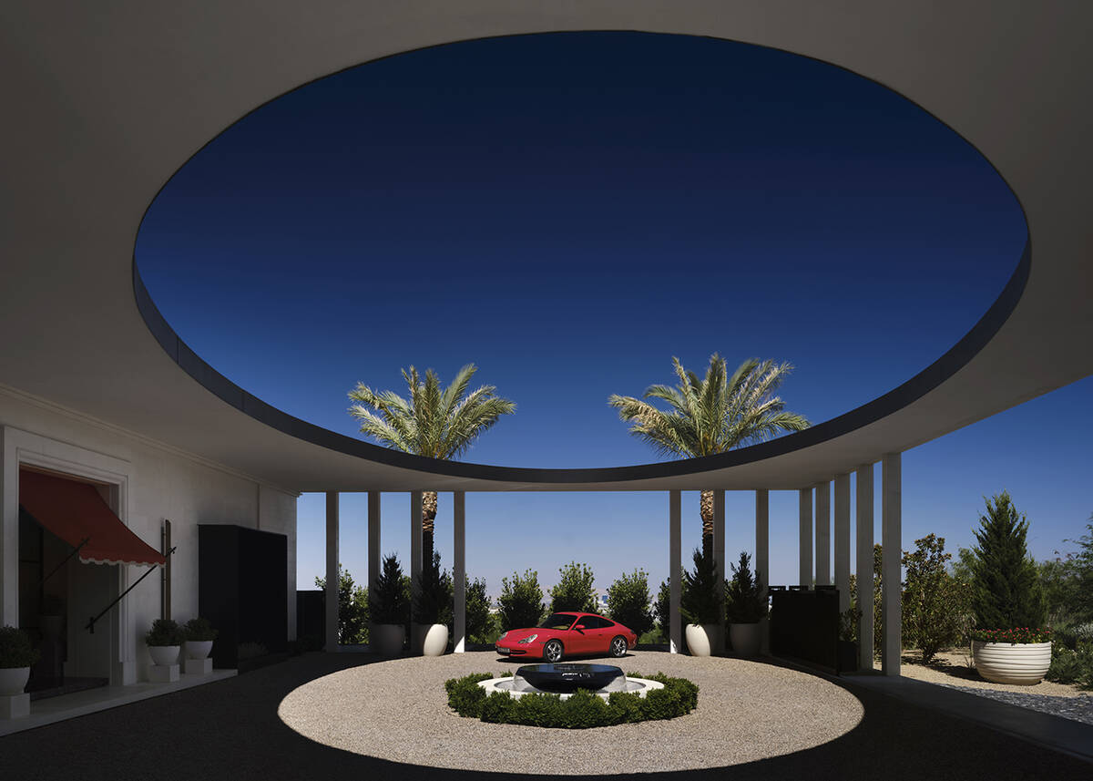 The home’s circular auto court is framed by a classical oculus structure over the driveway. ( ...