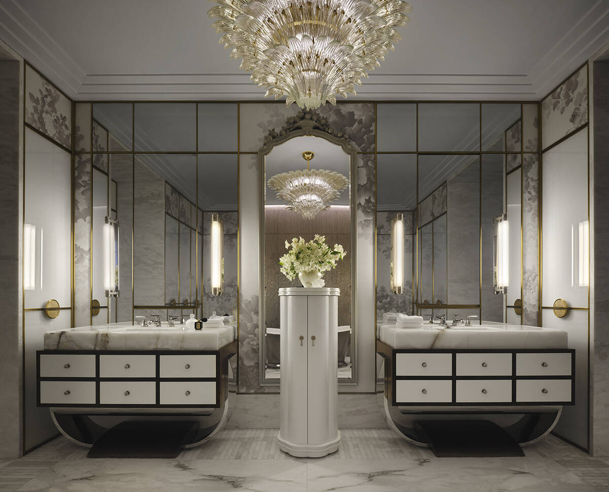 The luxurious bath has a private sauna, dual vanities with onyx counters and burl wood drawers ...