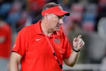 UNLV head coach Dan Mullen watches warm ups before their game against Sam Houston State on Frid ...