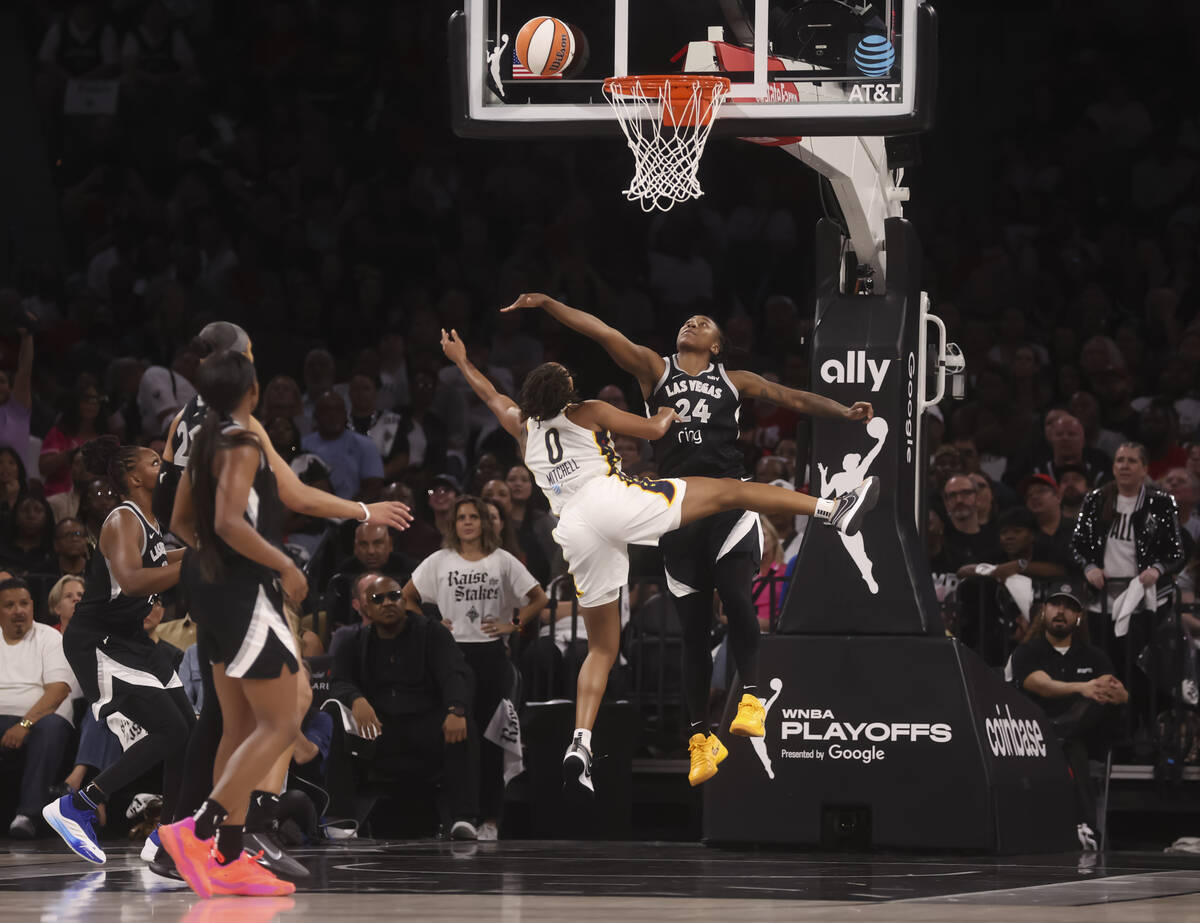 Aces guard Jewell Loyd (24) defends as Indiana Fever guard Kelsey Mitchell (0) attempts a shot ...
