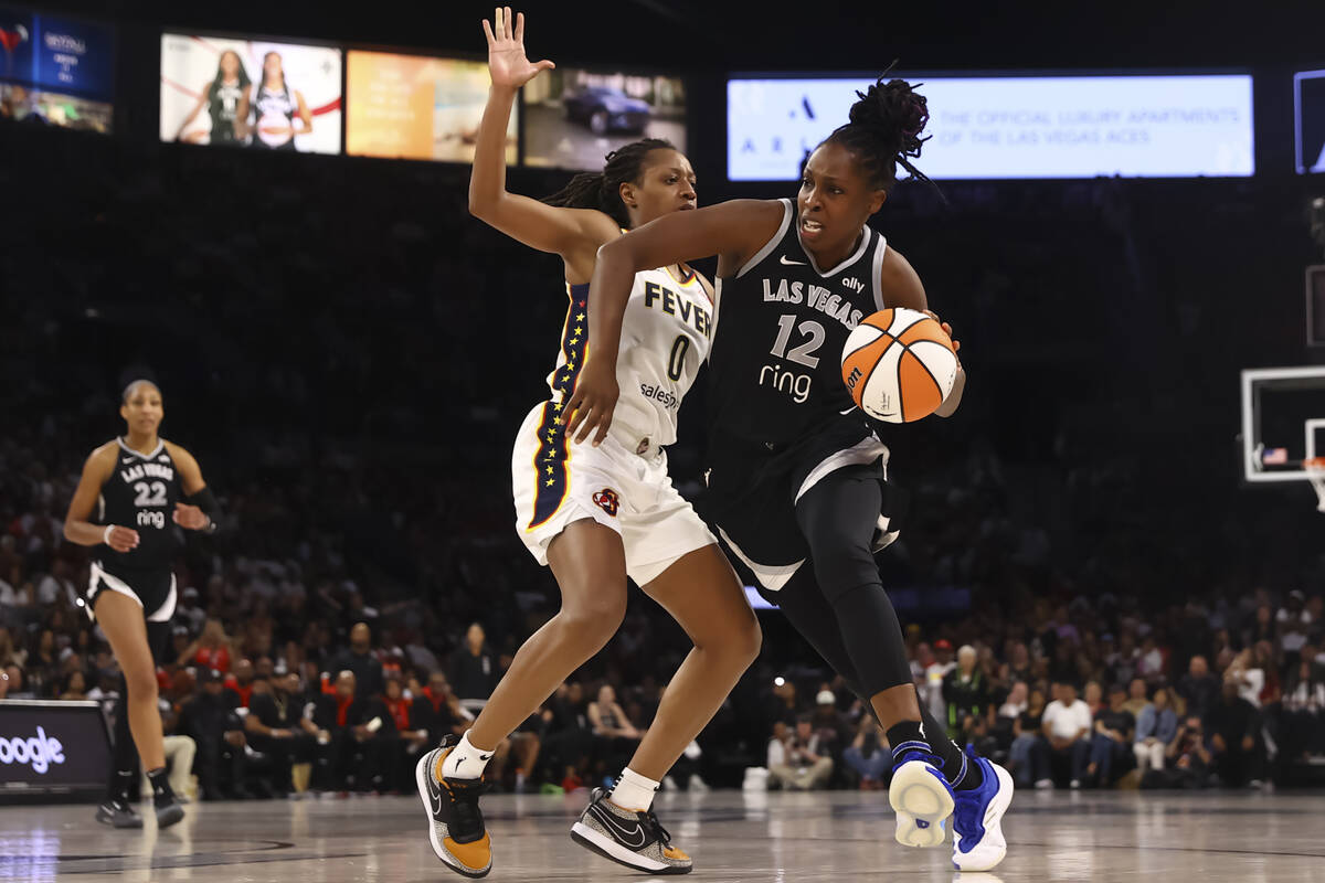 Aces guard Chelsea Gray (12) drives to the basket against Indiana Fever guard Kelsey Mitchell ( ...