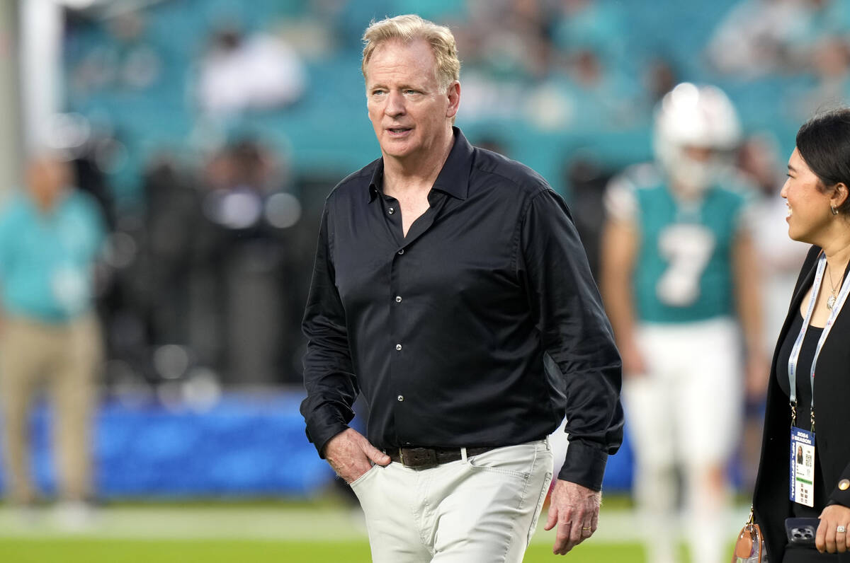 NFL Commissioner Roger Goodell walks on the field before an NFL football game between the Miami ...
