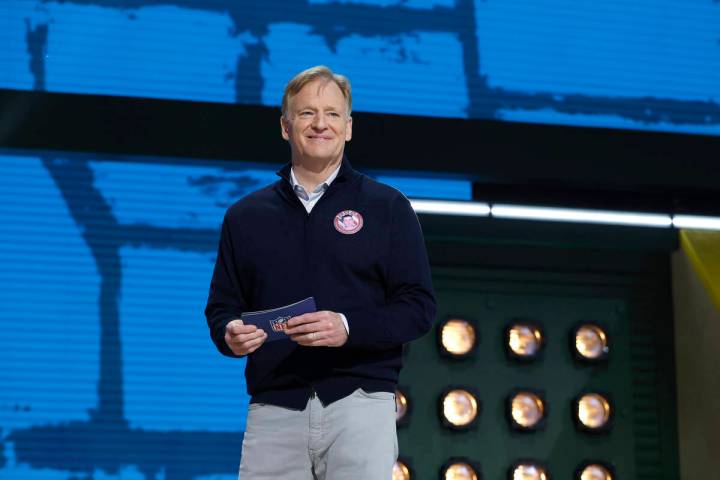 NFL Commissioner Roger Goodell motions on stage during the second round of the NFL football dra ...