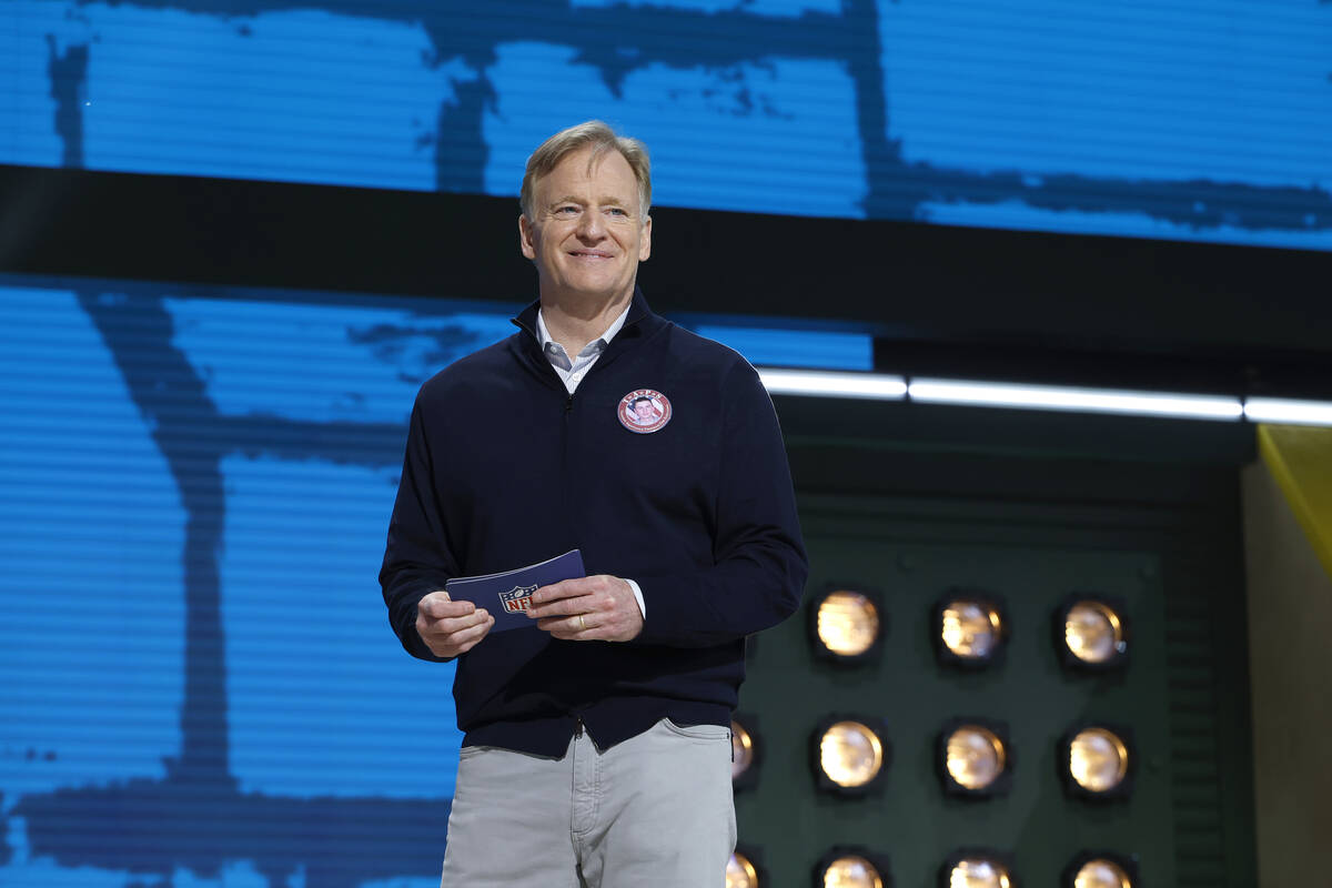 NFL Commissioner Roger Goodell motions on stage during the second round of the NFL football dra ...