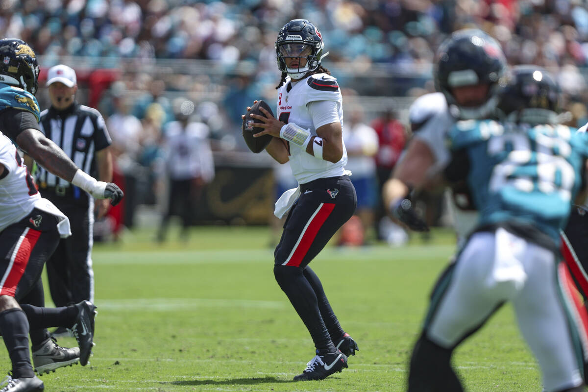 Houston Texans quarterback C.J. Stroud (7) looks downfield during an NFL football game against ...