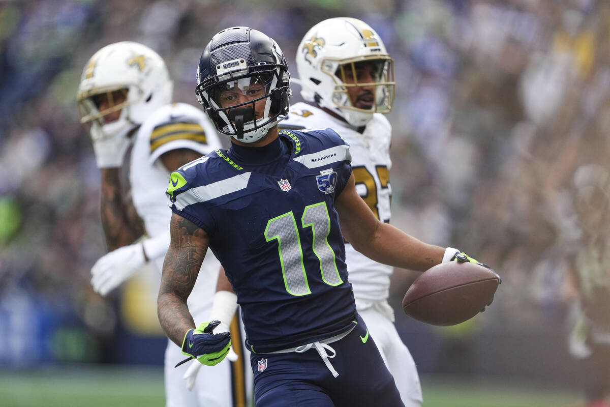 Seattle Seahawks wide receiver Jaxon Smith-Njigba (11) reacts after a reception during an NFL f ...