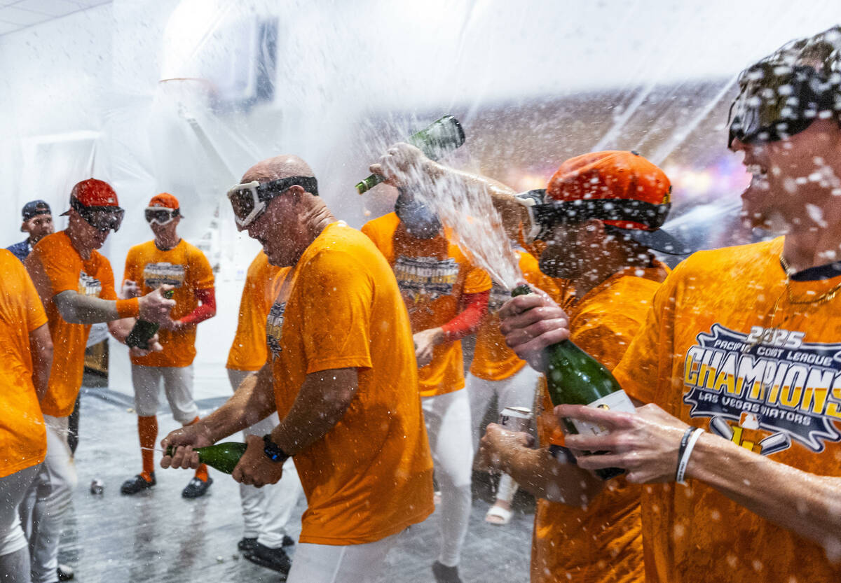 The Aviators enjoy a champagne shower as they celebrate their win over the Tacoma Rainiers 7-3 ...