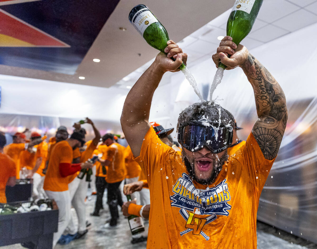 Aviators infielder Euribiel Angeles (3) enjoy a champagne shower as he and teammates celebrate ...