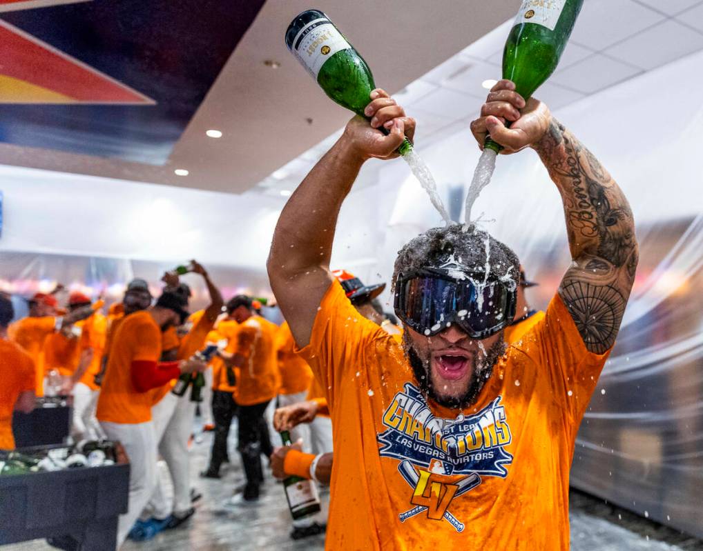 Aviators infielder Euribiel Angeles (3) enjoy a champagne shower as he and teammates celebrate ...