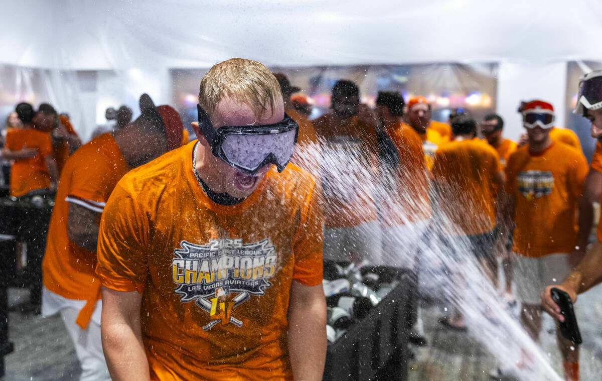 The Aviators enjoy a champagne shower as they celebrate their win over the Tacoma Rainiers 7-3 ...