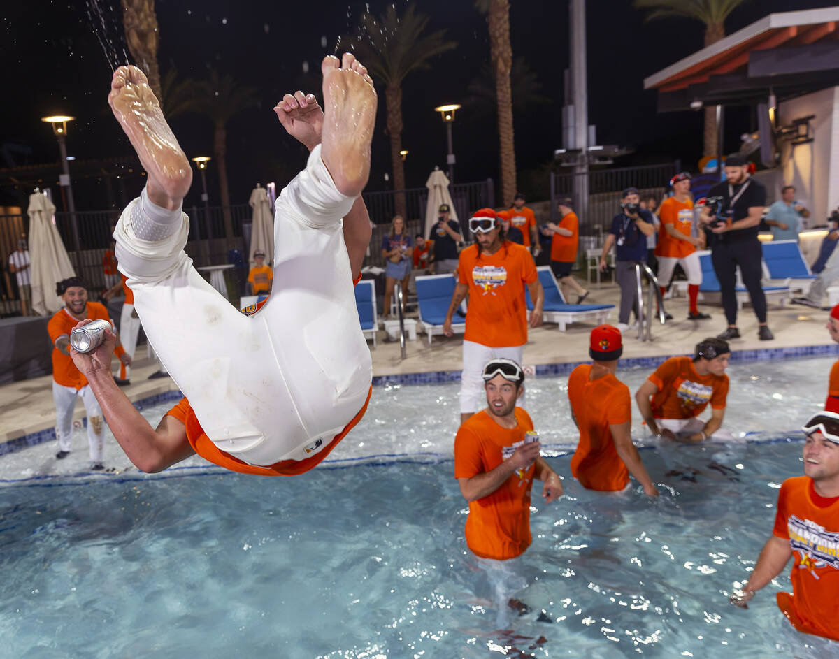 Aviators players jump into the outfield pool to celebrate their win over the Tacoma Rainiers 7- ...