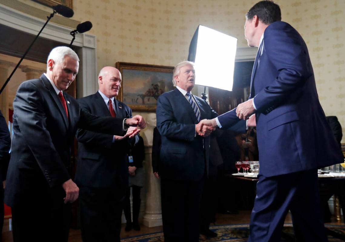 Vice President Mike Pence, left, and Secret Service Director Joseph Clancy stand as President D ...