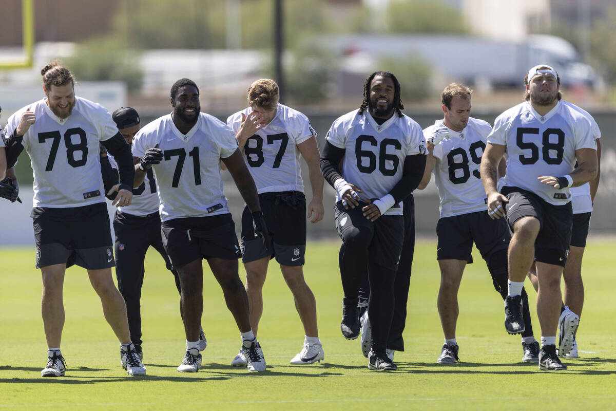 Raiders players, from left, Dalton Wagner (78), DJ Glaze (71), Michael Mayer (87), Dylan Parham ...