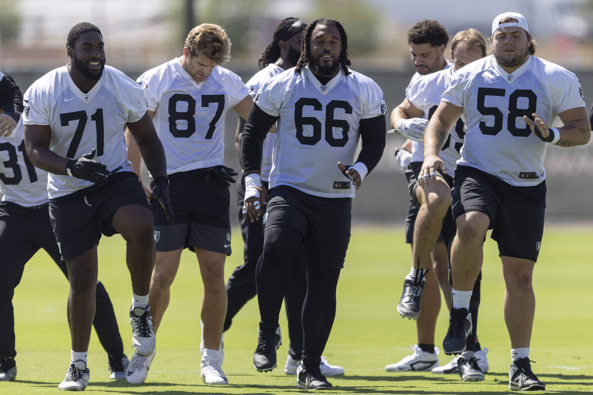 Raiders, from left, DJ Glaze (71), Michael Mayer (87), Dylan Parham (66) and Jackson Powers-Joh ...