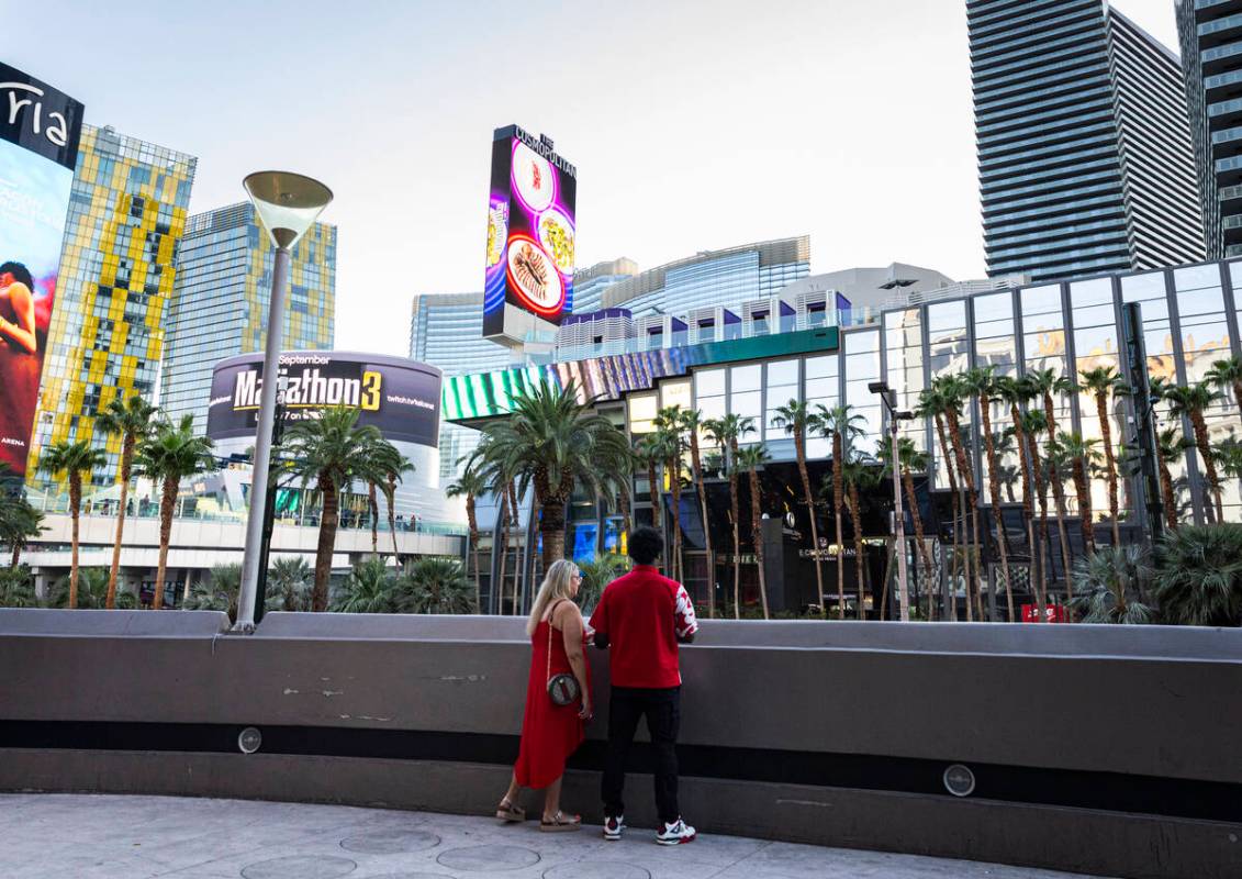 People look out from the Las Vegas Strip during Labor Day weekend on Sunday, Aug. 31, 2025, in ...