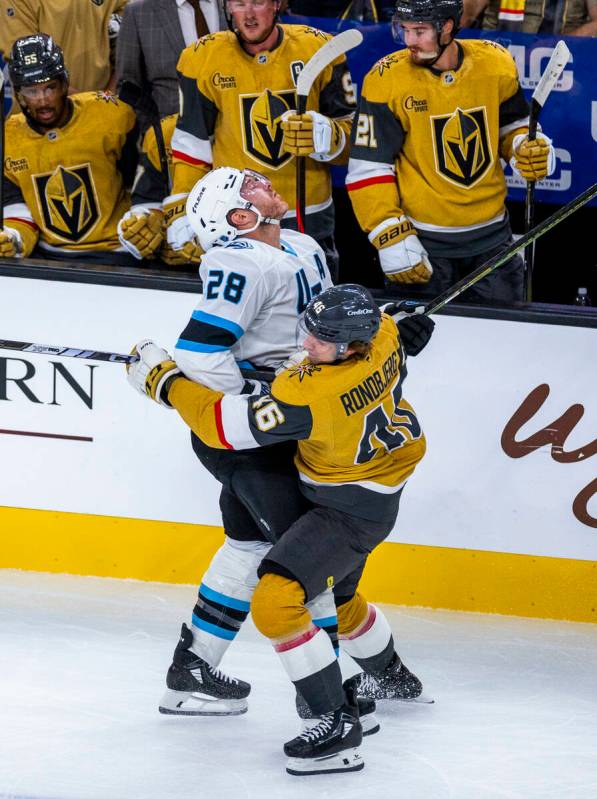 Utah Mammoth defenseman Ian Cole (28) collides with Golden Knights right wing Jonas Rondbjerg ( ...
