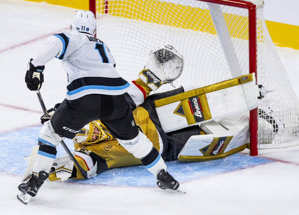 Golden Knights goaltender Adin Hill (33) is scored on by Utah Mammoth right wing Dylan Guenther ...